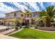 Beautiful two-story home featuring a well-maintained lawn, desert landscaping, and a spacious three-car garage at 2302 S Canfield --, Mesa, AZ 85209