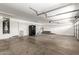 Spacious two-car garage with ample storage space and high ceilings, perfect for vehicles and projects at 2302 S Canfield --, Mesa, AZ 85209