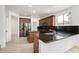 Open concept kitchen with island, granite countertops, and stainless steel appliances at 2302 S Canfield --, Mesa, AZ 85209