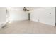 Open living room with ceiling fan and neutral tile flooring at 2302 S Canfield --, Mesa, AZ 85209