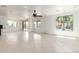 Expansive living room featuring natural light, tile flooring, and access to backyard at 2302 S Canfield --, Mesa, AZ 85209