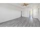 Bright main bedroom boasts wood grain floors, arched doorway, and access to ensuite at 2302 S Canfield --, Mesa, AZ 85209