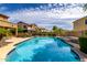 Stunning pool with clear blue water, surrounded by well-maintained landscaping, and a relaxing spa at 2302 S Canfield --, Mesa, AZ 85209