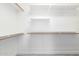 Walk-in closet provides ample storage with multiple shelves and hanging racks at 2302 S Canfield --, Mesa, AZ 85209