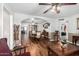 Open-concept layout featuring wood floors, a dining set, and views into the living spaces at 2419 E Billings St, Mesa, AZ 85213