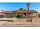 Charming single-level home boasting a low-maintenance yard, with address numbers displayed near the front door at 2419 E Billings St, Mesa, AZ 85213