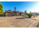 Single Gathering home with long driveway leading to attached garage and desert landscaping at 2419 E Billings St, Mesa, AZ 85213