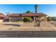 Well maintained house featuring desert landscaping, covered porch, and an attached garage at 2419 E Billings St, Mesa, AZ 85213