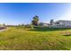 A grassy area with trees, sidewalks and apartment buildings at 2419 E Billings St, Mesa, AZ 85213
