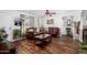 Cozy living room with wood floors, neutral walls, traditional furnishings, and natural light at 2419 E Billings St, Mesa, AZ 85213