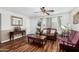 Inviting living room with wood flooring, traditional furnishings, and a neutral color palette at 2419 E Billings St, Mesa, AZ 85213