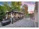 Relaxing backyard featuring a gazebo, outdoor seating, dining area, and pool, perfect for entertaining under string lights at 249 E Palomino Ct, Gilbert, AZ 85296