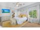 Bright bedroom with yellow accents, a ceiling fan, and windows with sheer curtains at 249 E Palomino Ct, Gilbert, AZ 85296