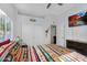 Bedroom with a closet and a tv above the fireplace, creating a cozy atmosphere at 249 E Palomino Ct, Gilbert, AZ 85296