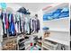 Well-organized walk-in closet featuring ample hanging space, shelving, and storage at 249 E Palomino Ct, Gilbert, AZ 85296