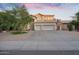 Spacious two-story home with a three-car garage and a well-manicured front yard at 249 E Palomino Ct, Gilbert, AZ 85296