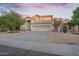 Charming two-story home with a well-maintained exterior, three-car garage, and manicured front yard in a quiet neighborhood at 249 E Palomino Ct, Gilbert, AZ 85296