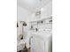 Bright laundry room features modern washer and dryer, along with ample storage at 249 E Palomino Ct, Gilbert, AZ 85296