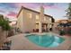 Backyard view of the home's exterior and pool at 249 E Palomino Ct, Gilbert, AZ 85296