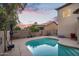 Backyard view of the home and pool at 249 E Palomino Ct, Gilbert, AZ 85296