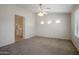 Neutral bedroom offering generous dimensions, a ceiling fan, and three windows providing ample light at 2615 W Silver Streak Way, San Tan Valley, AZ 85144