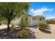Charming home featuring beautiful landscaping, a two-car garage, and a well-maintained exterior at 2615 W Silver Streak Way, San Tan Valley, AZ 85144