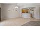 Open-concept space seamlessly connects the living area to the kitchen, great for entertaining at 2615 W Silver Streak Way, San Tan Valley, AZ 85144