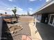 Backyard with gravel landscaping, small trees, and a covered patio perfect for outdoor relaxation at 2928 N 37Th Ave, Phoenix, AZ 85019