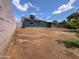 Wide backyard featuring partial grass cover and a covered patio, enclosed by a privacy fence at 2928 N 37Th Ave, Phoenix, AZ 85019