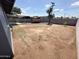 Spacious backyard featuring dirt and gravel landscaping, along with block fencing for privacy at 2928 N 37Th Ave, Phoenix, AZ 85019