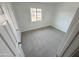 Bright, carpeted bedroom with a window and neutral walls at 2928 N 37Th Ave, Phoenix, AZ 85019