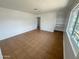 Bright living room with tile flooring, large windows, and built-in shelving at 2928 N 37Th Ave, Phoenix, AZ 85019