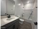 Stylish bathroom featuring a modern vanity, sleek fixtures, and shower-tub combination at 32661 N Newby Dr, San Tan Valley, AZ 85143