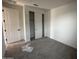 Bedroom with carpet flooring, a closet, and a window overlooking the outside at 32661 N Newby Dr, San Tan Valley, AZ 85143