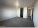 Spacious carpeted bedroom featuring a walk-in closet and ensuite access at 32661 N Newby Dr, San Tan Valley, AZ 85143