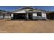 View of the home under construction with scaffolding, insulation, and a partially installed roof at 32661 N Newby Dr, San Tan Valley, AZ 85143