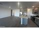 Modern kitchen with stainless steel appliances, granite countertops, and island at 32661 N Newby Dr, San Tan Valley, AZ 85143