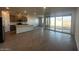 Open-concept living room showcases the kitchen, dining area, and outdoor access at 32661 N Newby Dr, San Tan Valley, AZ 85143