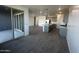 Open-concept living space featuring access to an outdoor patio and a modern kitchen at 32661 N Newby Dr, San Tan Valley, AZ 85143