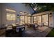 Beautifully designed back patio with plenty of seating, a wooden dining table, and a view of the home's interior at 3301 E Elm St, Phoenix, AZ 85018