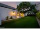 Large backyard featuring a well-maintained lawn, outdoor grill, and access to a charming back patio at 3301 E Elm St, Phoenix, AZ 85018