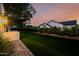 Expansive backyard with lush greenery, mature trees, and an outdoor grill area, perfect for outdoor entertaining at 3301 E Elm St, Phoenix, AZ 85018