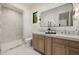 Bathroom features double sink vanity with marble countertop and a glass-enclosed shower at 3301 E Elm St, Phoenix, AZ 85018