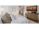 Comfortable bedroom featuring a stylish bed, modern artwork, and a view into the ensuite bathroom at 3301 E Elm St, Phoenix, AZ 85018