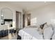 Inviting bedroom with a bed with decorative pillows, a stylish mirror and bathroom view at 3301 E Elm St, Phoenix, AZ 85018