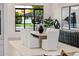 Modern dining room with hardwood floors, a large window, and elegant decor at 3301 E Elm St, Phoenix, AZ 85018