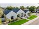 An aerial view showcases a modern home featuring manicured lawns, elegant landscaping, and a inviting entrance at 3301 E Elm St, Phoenix, AZ 85018