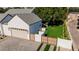 Aerial view features attached garage, stylish front yard with paved driveway and wooden gate enhancing curb appeal at 3301 E Elm St, Phoenix, AZ 85018