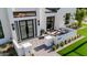 Inviting front entryway with double doors, stylish outdoor seating, and lush landscaping enhances the home's curb appeal at 3301 E Elm St, Phoenix, AZ 85018