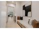 Inviting hallway with a built-in bench, soft cushions, and stylish artwork at 3301 E Elm St, Phoenix, AZ 85018